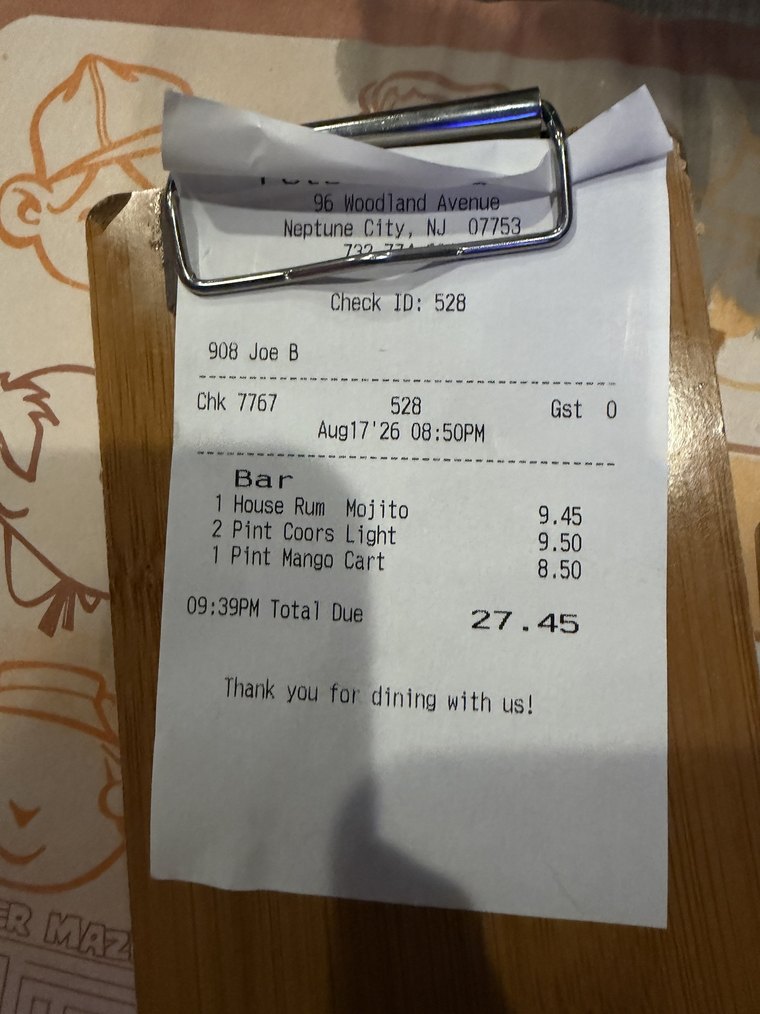 A paper receipt photographed on a table